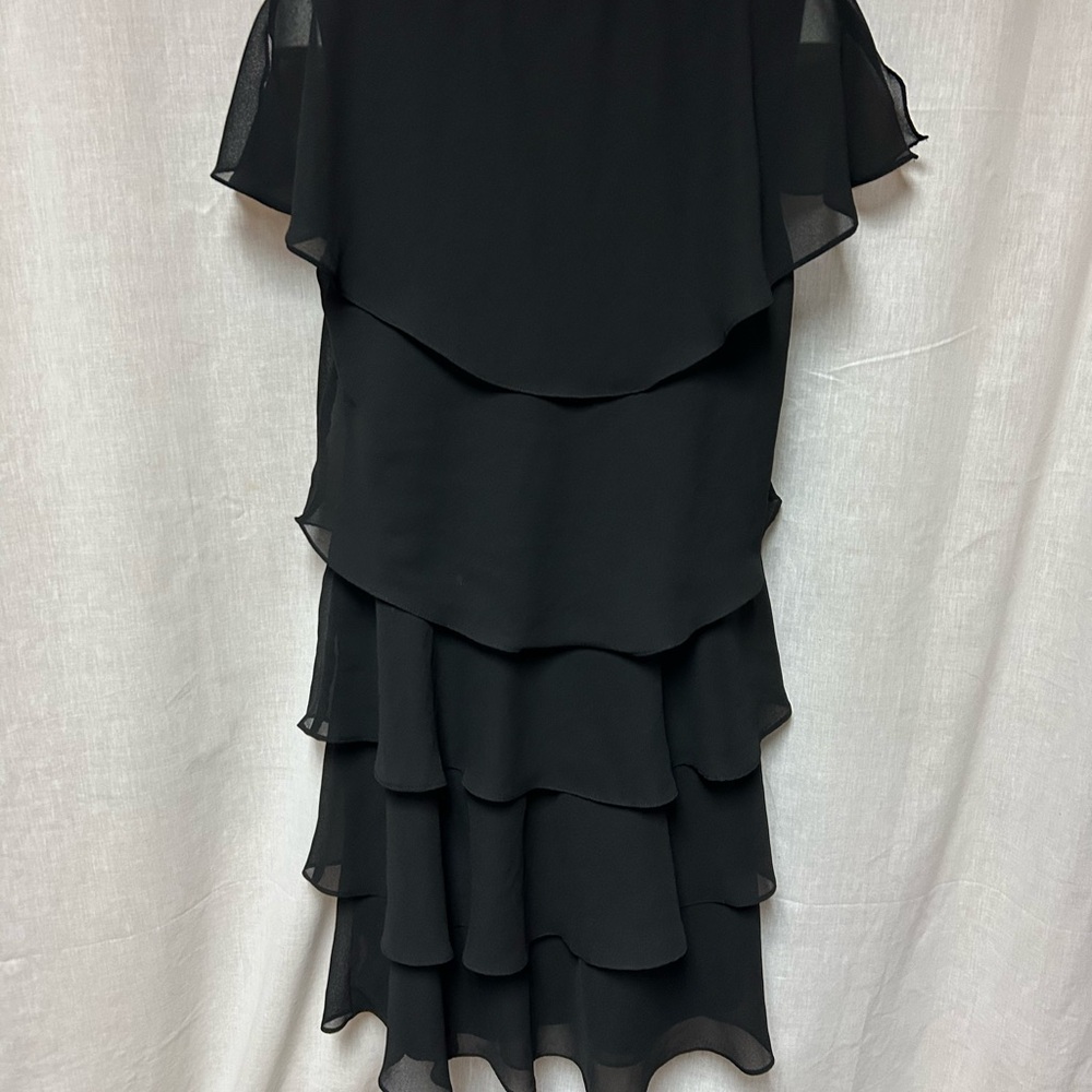 Black tiered sassy dress 
Cruise 
Hem 40” 23” armpit to armpit flat 
Size 18 - Picture 5 of 13
